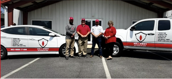 holloman-team image Holloman Exterminators team and trucks