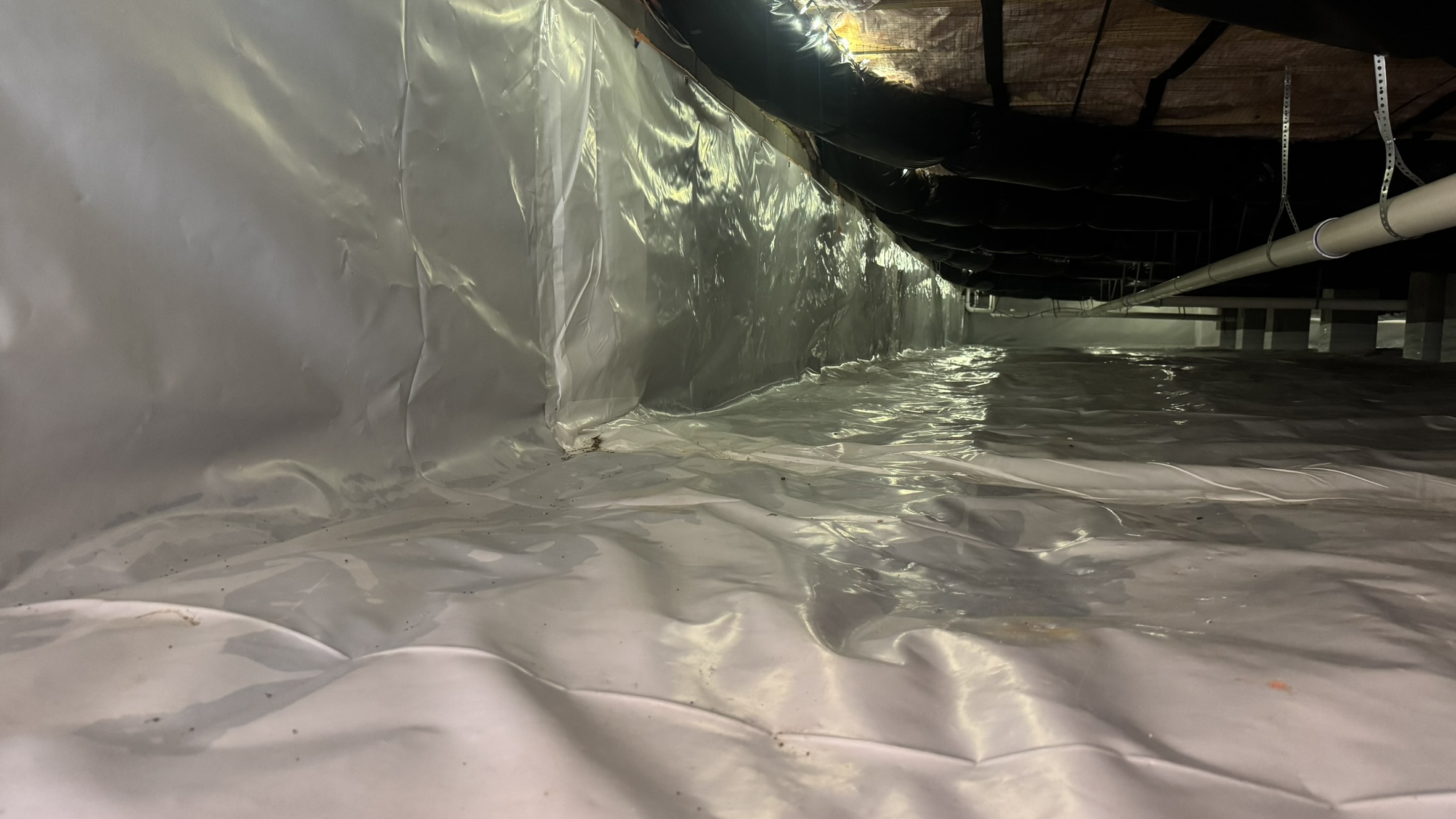 IMG_5637 image Professional equipment used for moisture control and dehumidification in a damp crawl space area